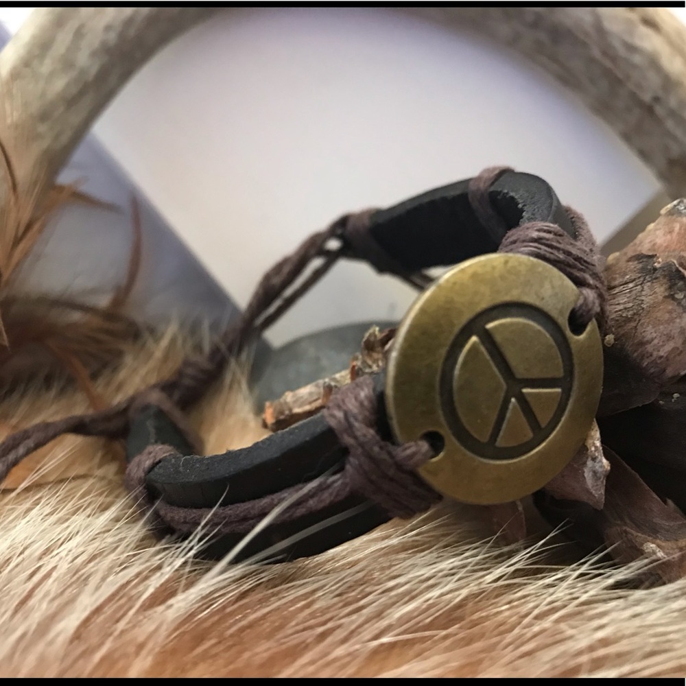 Black leather band with bronze engraved peace sign